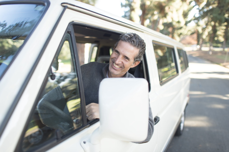one person, males, leaning, van, headrest, men, land vehicle, lean, business, people, smiling, mature men, sweater, man, home decor, beach wagon, mature adult