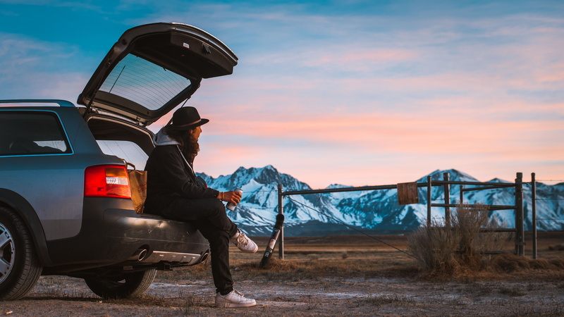 back, mountain, motor vehicle, people, pants, person, transportation, full length, land vehicle, warm clothing, winter, leisure activity, one Person, field