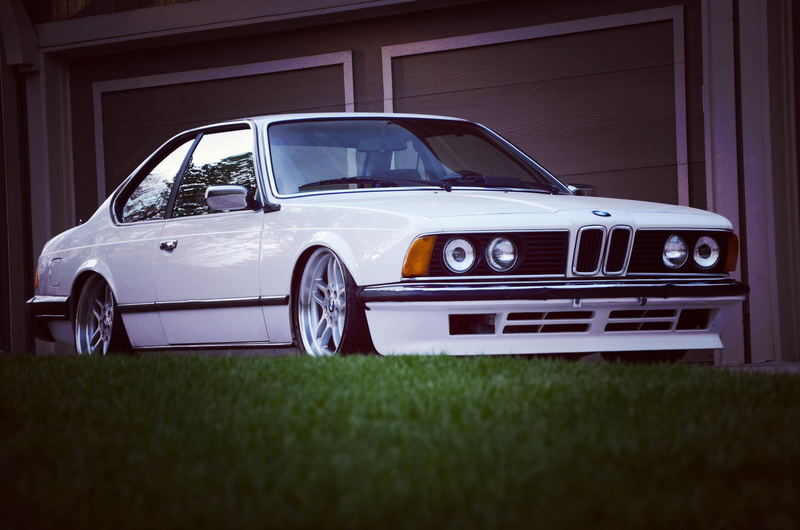 motor vehicle, retro styled, 1080P, architecture, E24, BMW, outdoors, transportation, white, land vehicle, stationary, classic, car, green color, nature