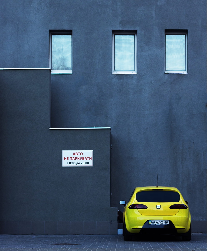 wall, mode of Transport, parking, urban Scene, text, 4K, street, urban, parking Lot, seat, indoors, concrete, building exterior, built structure, building