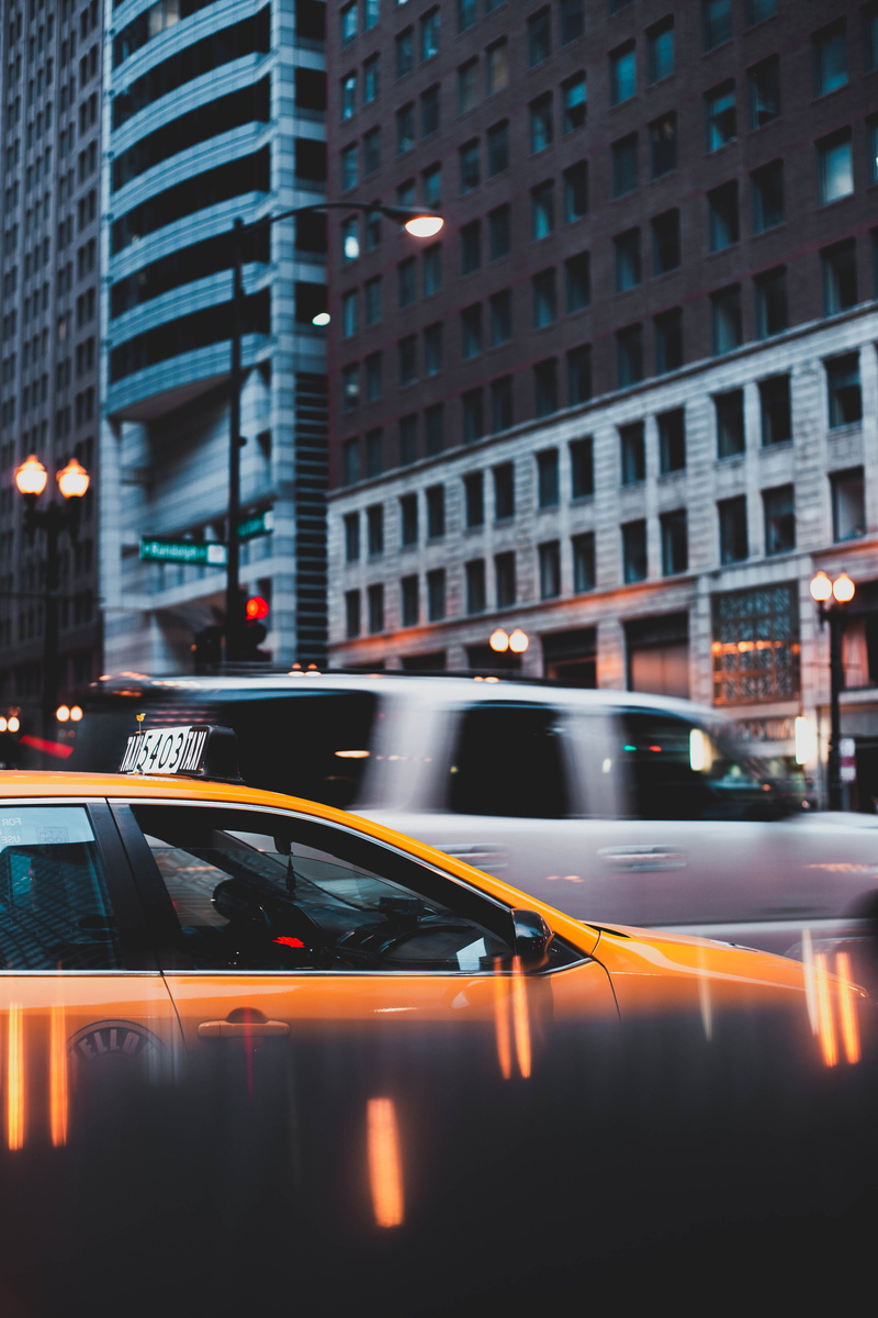 light, skyscraper, motor vehicle, gray, transportation system, built structure, downtown, dusk, vehicles, urban, blur, no people, illuminated, evening