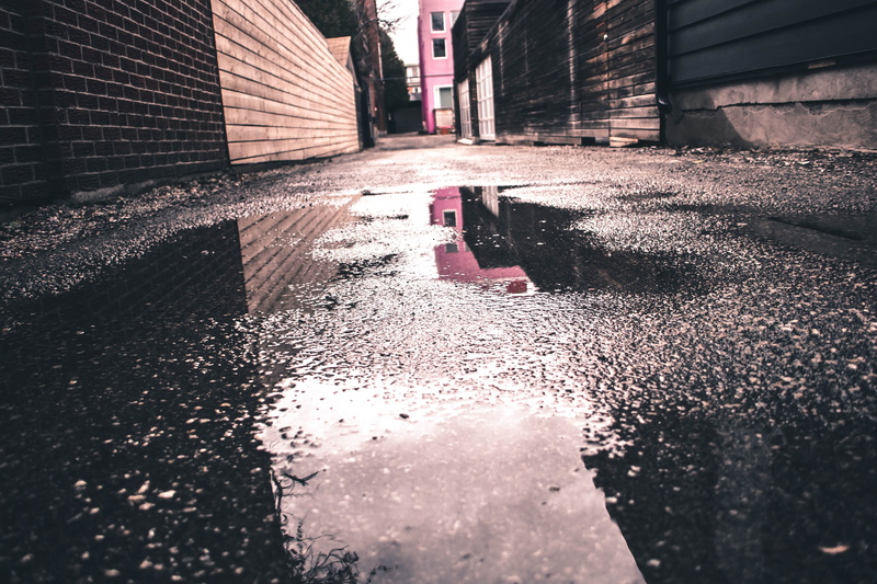 wet, water, transportation, mist, surface level, built structure, direction, pastel, rain, street, puddle, city, alley, rainy day, road, fog, perspective
