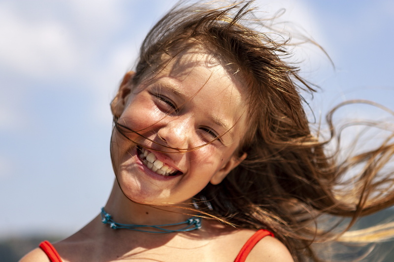 hair, outdoors, wind, happy, sky, human hair, skin, focus on foreground, hairstyle, sunburnt, close-up, people, one person, young adult, women, smiling