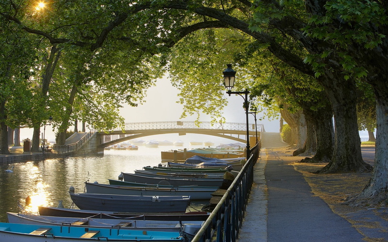 day, boats, travel Destinations, outdoors, moored, canal, in a row, bridge - Man Made Structure, water, street Light, dusk, park - Man Made Space, no People