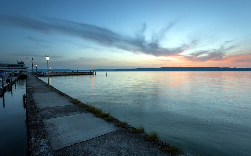 nautical vessel, outdoors, twilight, brown, tranquility, sunset, water, dock, nature, pier, cloud - sky, illuminated, built structure, bay, no people, beauty in nature