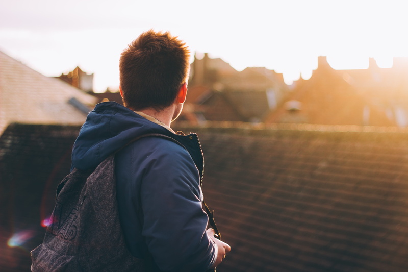 jacket, city life, standing, lens flare, sky, young Adult, building exterior, blue, 5K, brown, real people, adults only, built structure, blue jacket