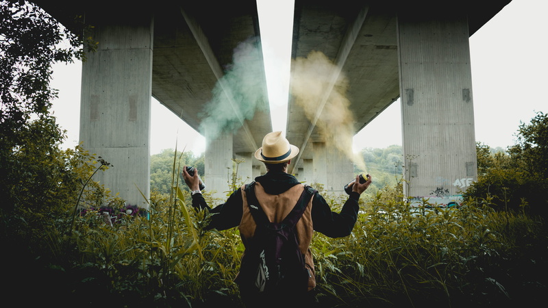 day, men, clothing, architecture, outdoors, performance, women, black and brown, real people, bridge, wearing, man, people, brown, plant, hoodie, black