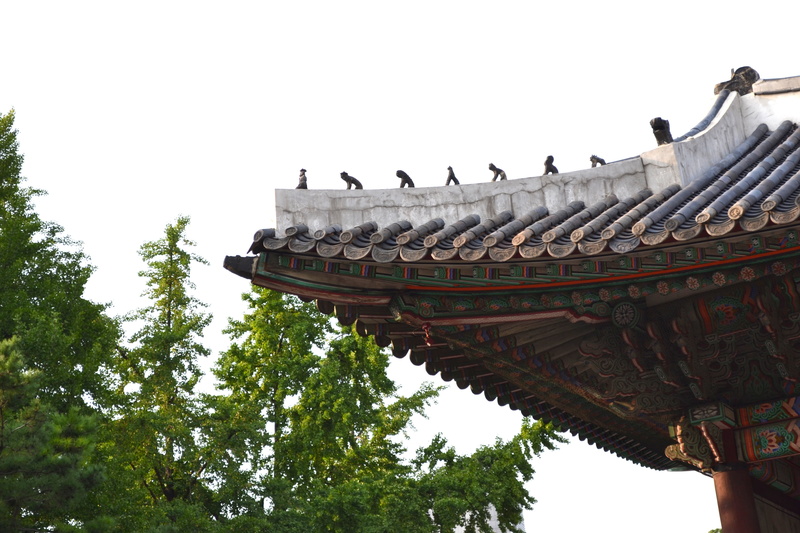 forbidden city, plant, place of worship, building, tree, old school, roof tile, sky, beside, building exterior, daytime, eaves, between, history, no people