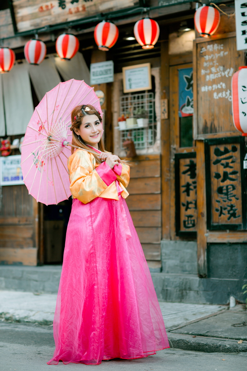 one person, beautiful woman, girl, lifestyles, portrait, real people, traditional clothing, asian, leisure activity, cute, standing, pink color, looking at camera
