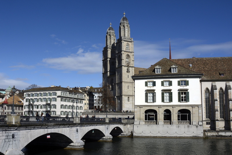 transportation, n, place of worship, grossmünster, nature, building, sky, spire, helmhaus wasserkirche, outdoors, places of interest, limmat, city, tower