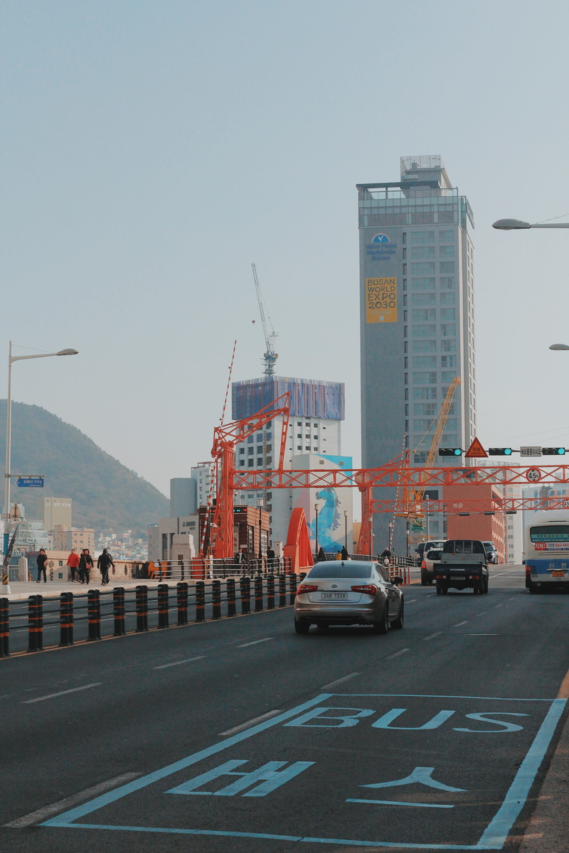 busan, clear sky, road marking, city, nature, symbol, building, city life, asphalt, office building exterior, street, highway, vehicle, skyscraper, tarmac