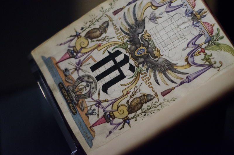 the getty, table, selective focus, representation, single object, no people, pattern, ink, typography, craft, ornate, illustration, religion, black background
