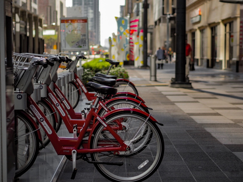 day, building exterior, bicycle, built structure, incidental people, travel, buildings, near, footpath, land vehicle, 1080P, bike, pavement, stationary