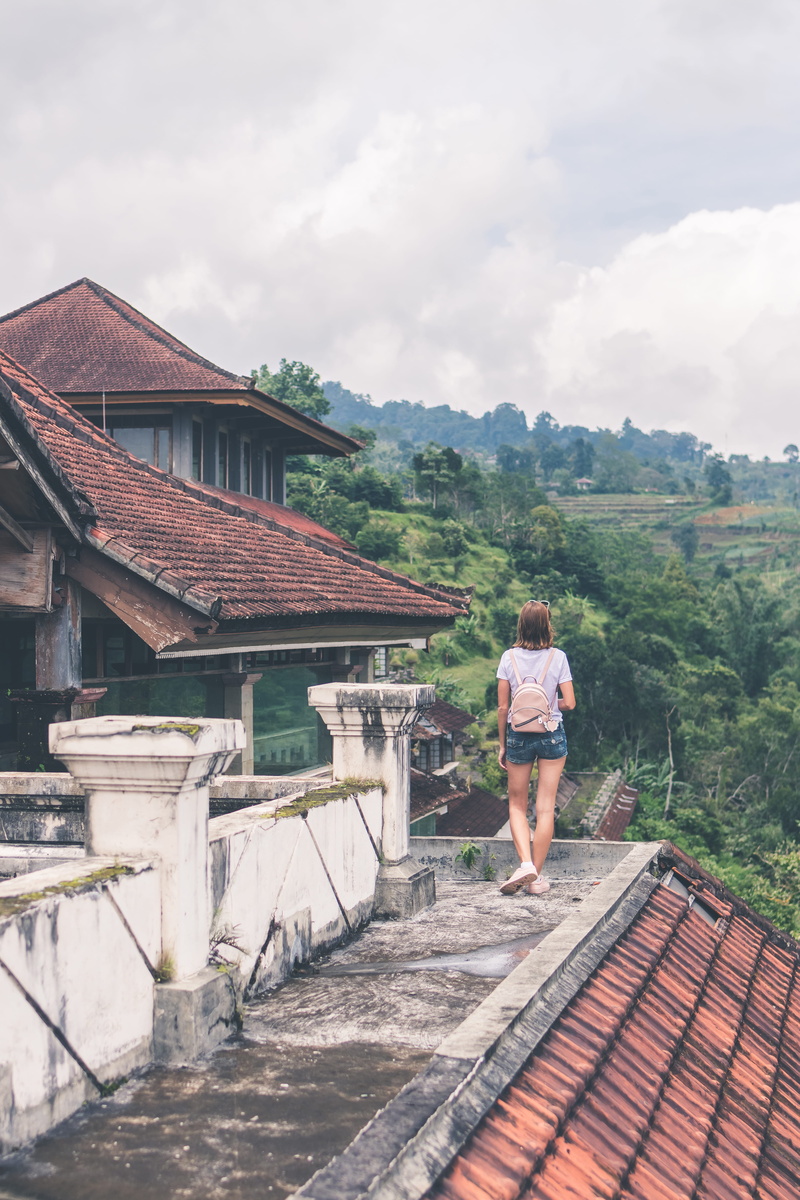 building, jungle, concrete, sky, outdoors, lifestyles, nature, tree, gray, standing, building exterior, architecture, roof, one person, backpack, 5K, person
