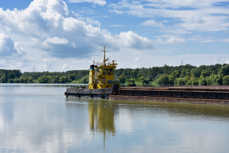 cloud - sky, port, nautical vessel, outdoors, reflection, freight, no people, built structure, lake, river, barges, water, barge, mode of transportation