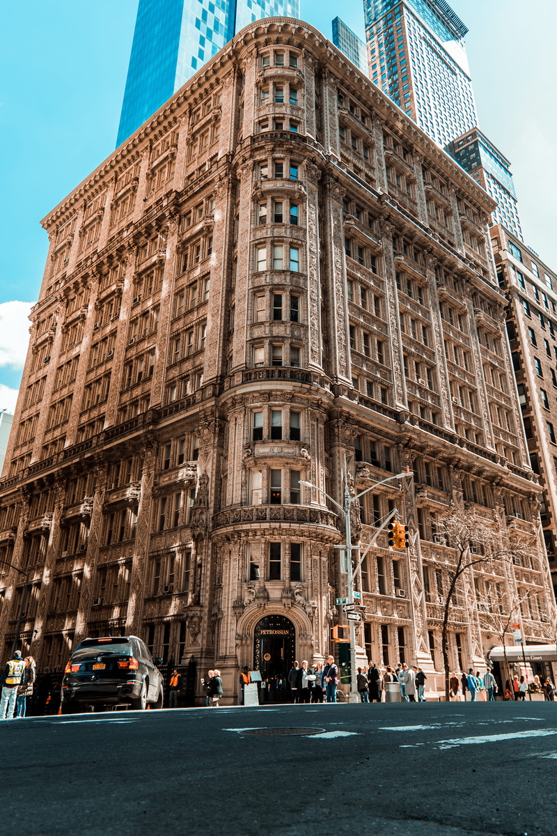group of people, low angle view, street, travel, rise, sky, city, real people, outdoors, nature, tourism, day, built structure, concrete, building, brown