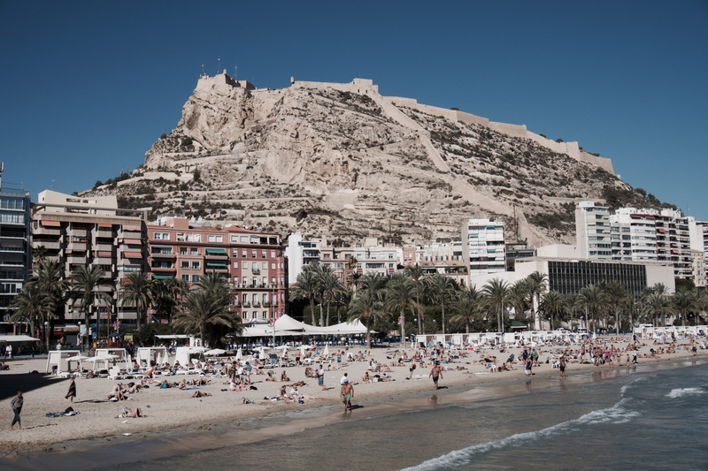 outdoors, high rise building, sea, large group of people, people, tourism, hotel, color Image, built Structure, architecture And Buildings, building, seashore