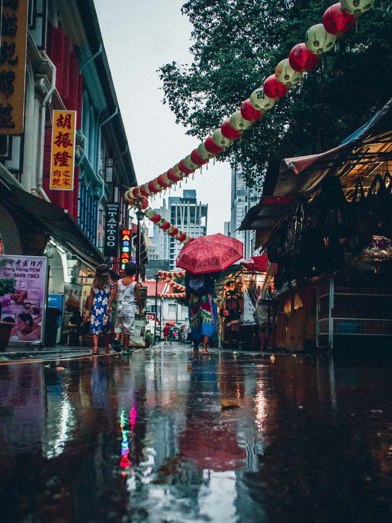 2K, city, chinatown, bright, person, rainy season, monsoon, built structure, near, incidental people, daytime, day, umbrella, wet, two, group, religion