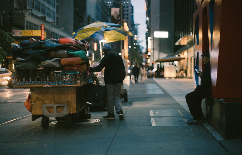 light, wet, walking, architecture, umbrella, retail, sidewalk, urban, love, street, nyc, building exterior, seller, man, adult, market, people, commerce