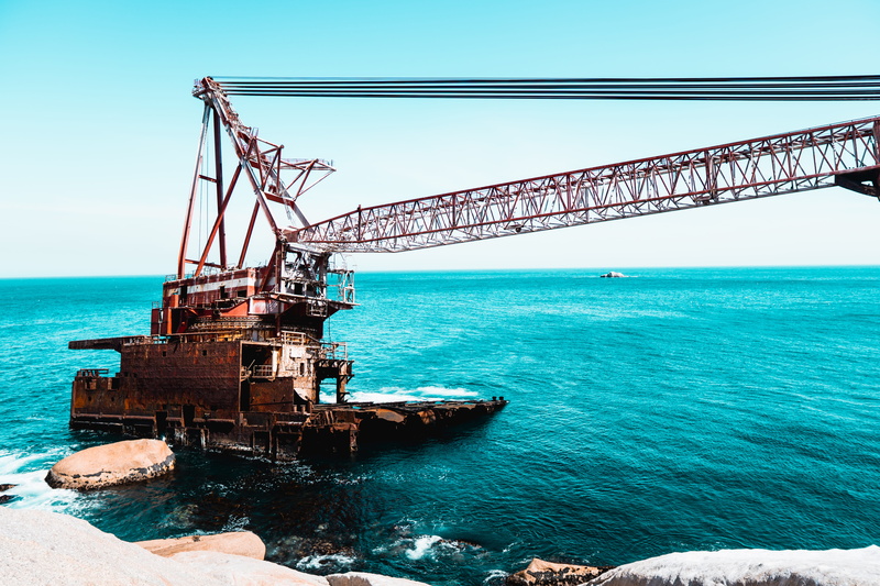 rock, connection, boat, vehicle, vessel, outdoors, construction crane, sea, cape town, mode of transportation, shipwreck, beauty in nature, water, sky