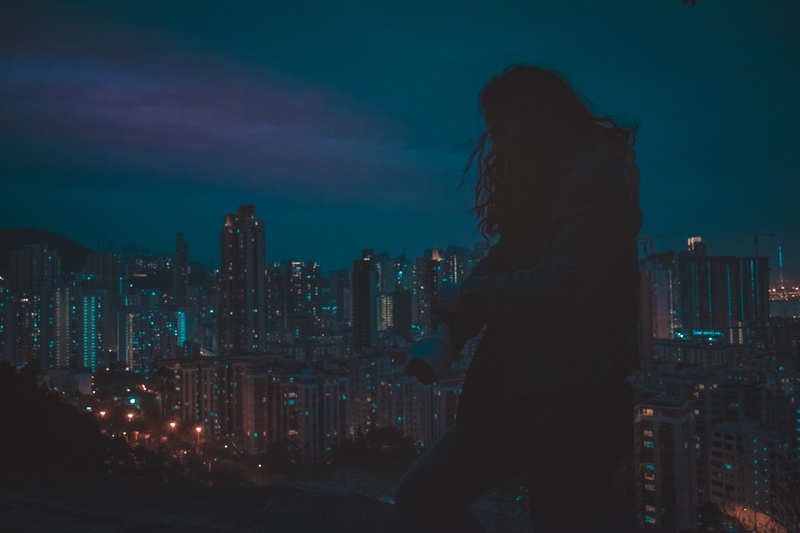 modern, financial district, city, illuminated, skyscraper, hairstyle, built structure, women, one person, lifestyles, sky, hongkong, adult, city life, lights