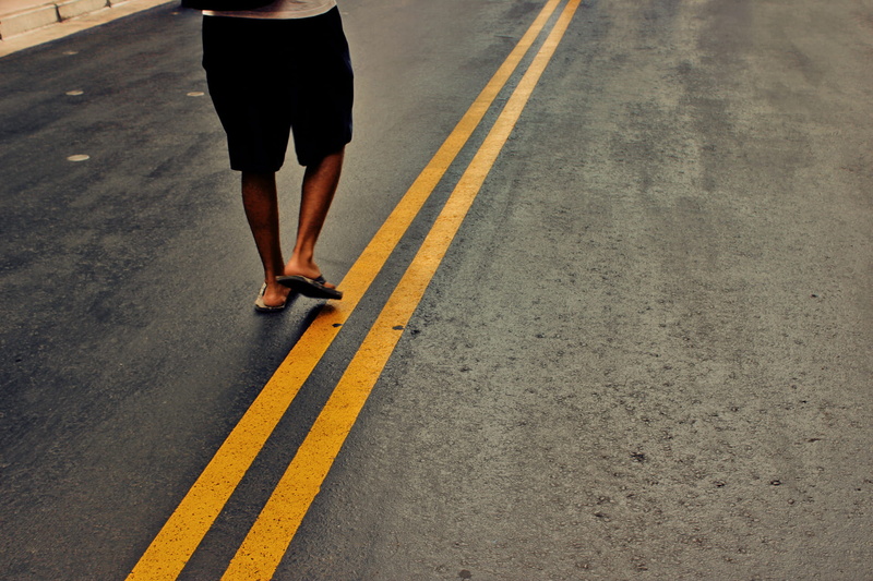 flip flop, one Person, outdoors, transportation, middle, marking, human limb, man, blurred Motion, road marking, city Life, action, running, daytime, walking