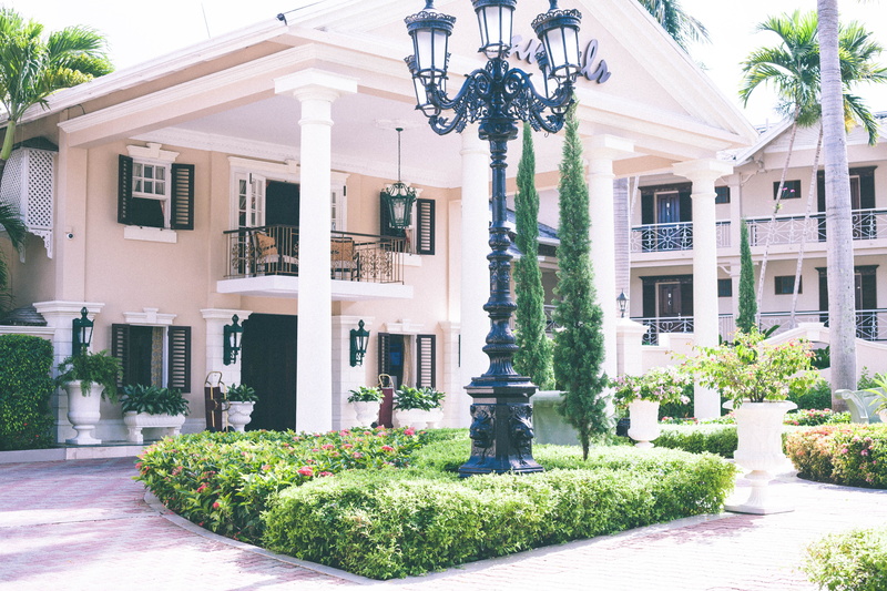 residential district, houseplant, house, lighting equipment, shutters, outdoors, green color, pillars, architecture, architectural column, street, street light