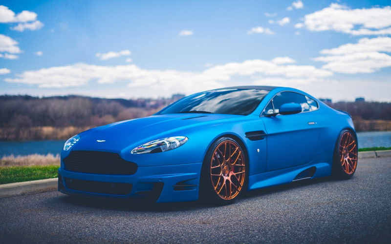 cloud - sky, car, wheel, convertible, vintage car, luxury, no people, road, nature, outdoors, motor vehicle, stationary, retro styled, focus on foreground