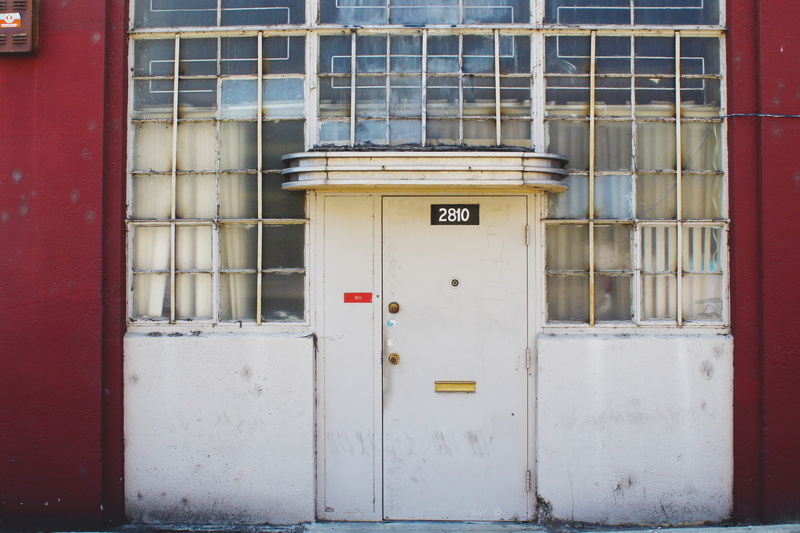 wall - building feature, telephone, outdoors, windows, closed, connection, no people, convenience, built structure, day, security, communication, facade