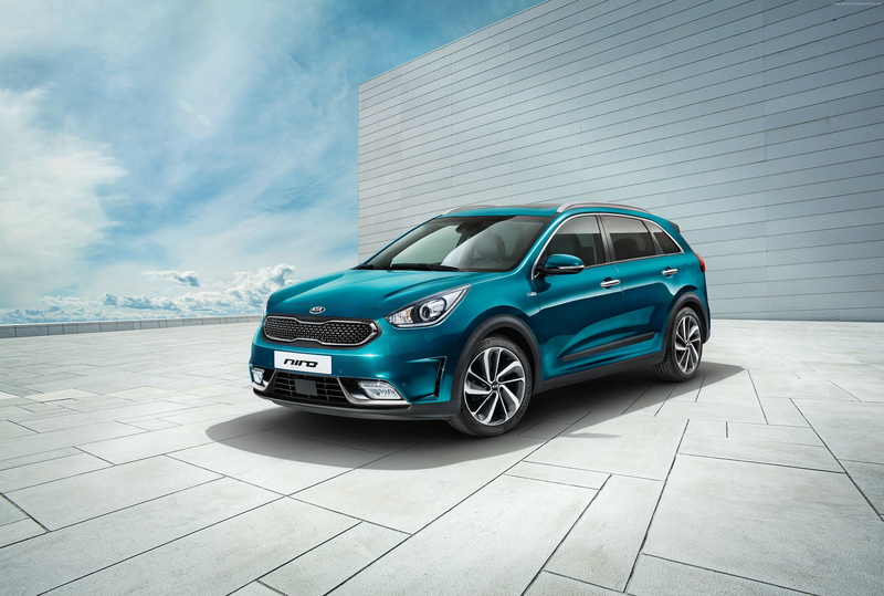 electric cars, wealth, Kia Niro Worldwide, hybrid, land vehicle, car, blue, outdoors, city, mode of transportation, cloud - sky, transportation, garage