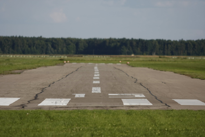 grass, green color, outdoors, no people, communication, 4K, aviation, sky, concrete, road, nature, direction, field, plant, dividing line, diminishing perspective