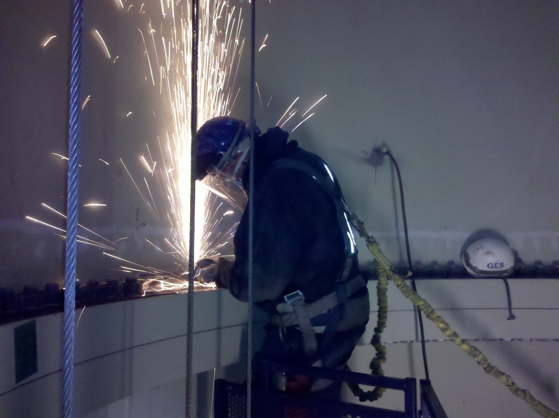 architecture, glass - material, industrial, built structure, laborer, welder, outdoors, wind turbine tube, water, technician, one person, winter, snow