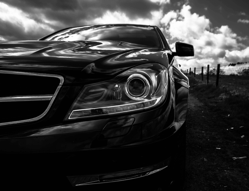 wealth, automobile, chrome, nature, outdoors, engine, machine, land vehicle, clouds, tire, mode of transportation, technology, speed, field, focus on foreground