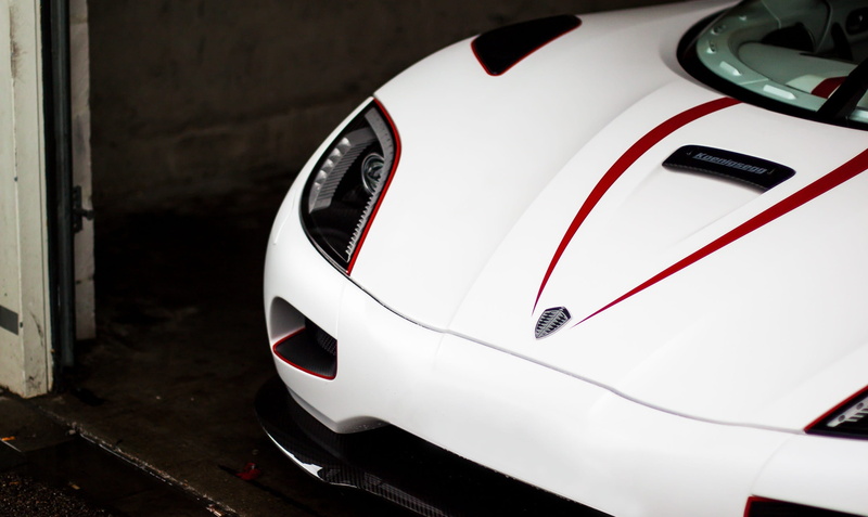 swedish brand, sweden, hood, high angle view, still life, auto, car, koenigsegg, wheel, sports car, mode of transportation, red, focus on foreground, transportation