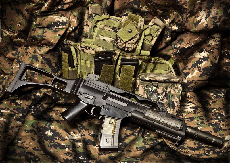 no people, government, threats, assault rifle, field, ammunition, holder, land, weapon, outdoors, military, day, weapons, high angle view, magazine, aggression