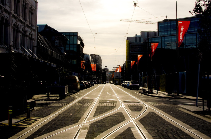 reflection on tracks, sign, city sunset, built structure, building, diminishing perspective, road, building exterior, new regent street precinct, sky, small city