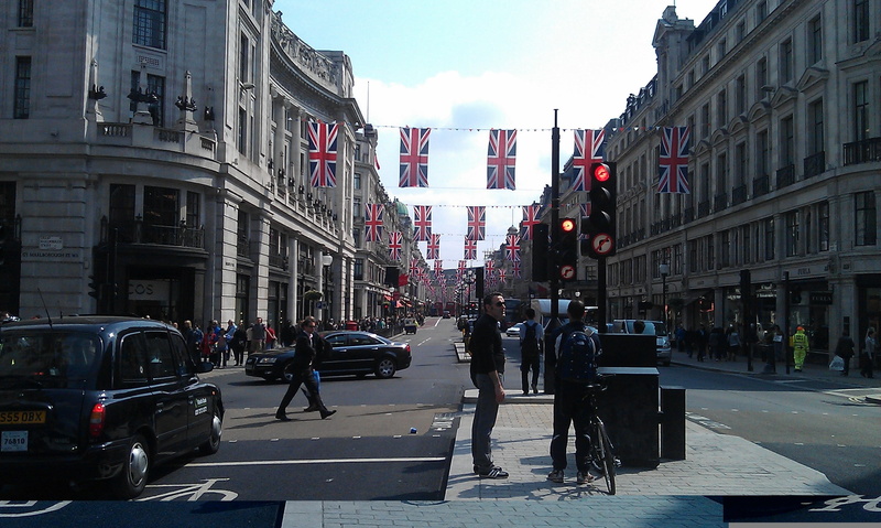 capital, city street, city life, day, road, building exterior, group of people, built structure, union jack, transportation, cityscape, britain, mode of transportation