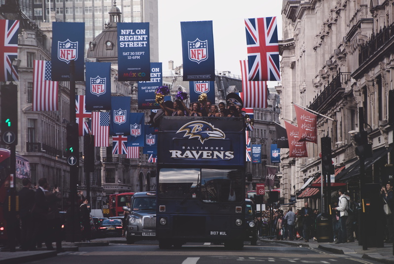 building exterior, city, photography, text, league, london, celebrating, outdoors, large group of people, baltimore, game, land vehicle, football, communication