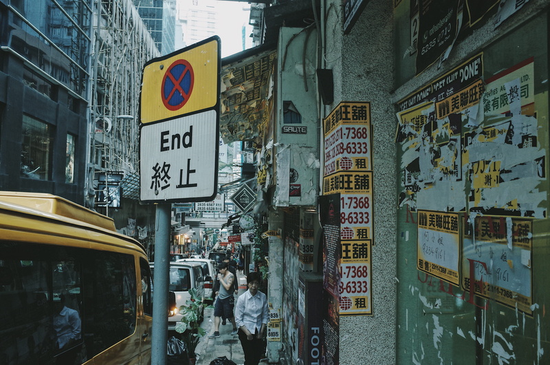 city, script, text, sign, communication, real people, person, advertisement, group of people, hongkong, built structure, walking, transportation, tip, street