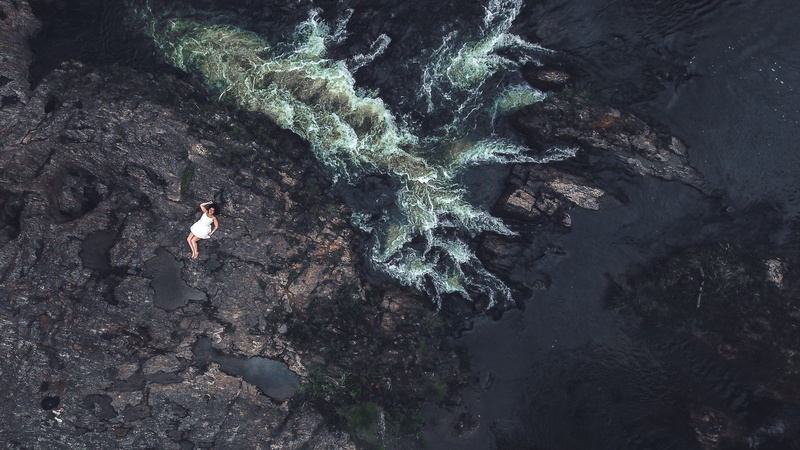vacations, leisure activity, aerial, young adult, view, full length, birds eye view, solid, aerial photography, waves, outdoors, drone shot, rock formation