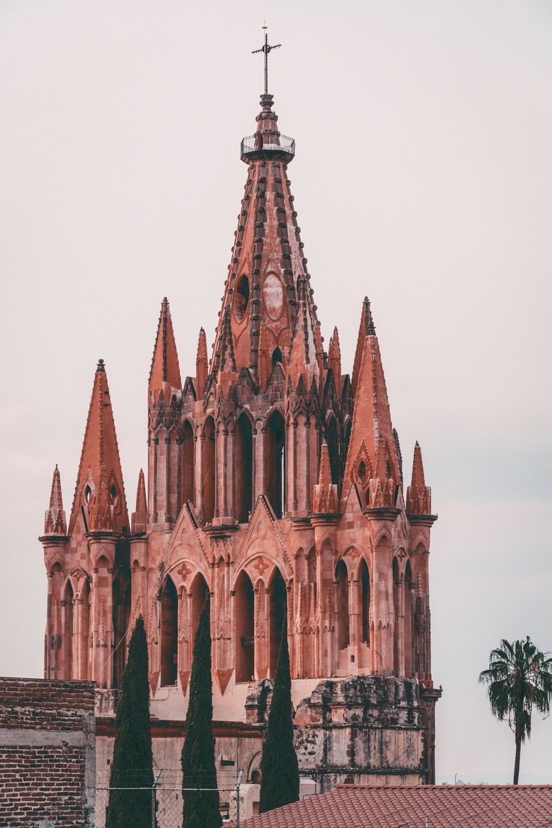 san miguel de allende, steeple, day, catholic, building exterior, clear sky, christian church, built structure, travel destinations, no people, traditional architecture