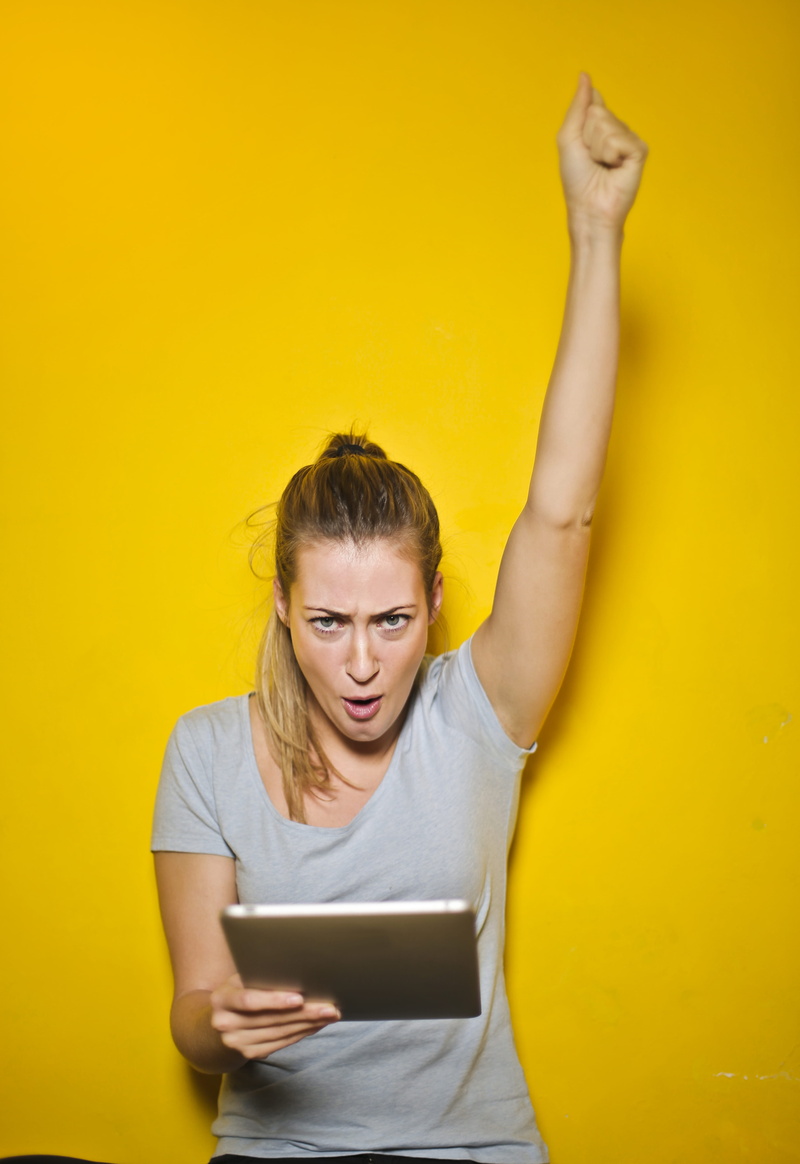 casual, leisure activity, connection, young women, Victory, excited, excitement, close-up, wireless technology, one person, hairstyle, yellow, beautiful woman