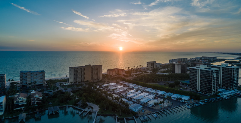 sunset, sea, sky, horizon over water, built structure, evening, skyscraper, cityscape, bay, cloud - sky, beach, harbor, waterfront, office building exterior