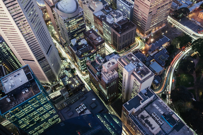 skyscraper, perspective, building exterior, view, skycrapers, city, aerial, built structure, city street, tall - high, city life, crowd, architecture, illuminated