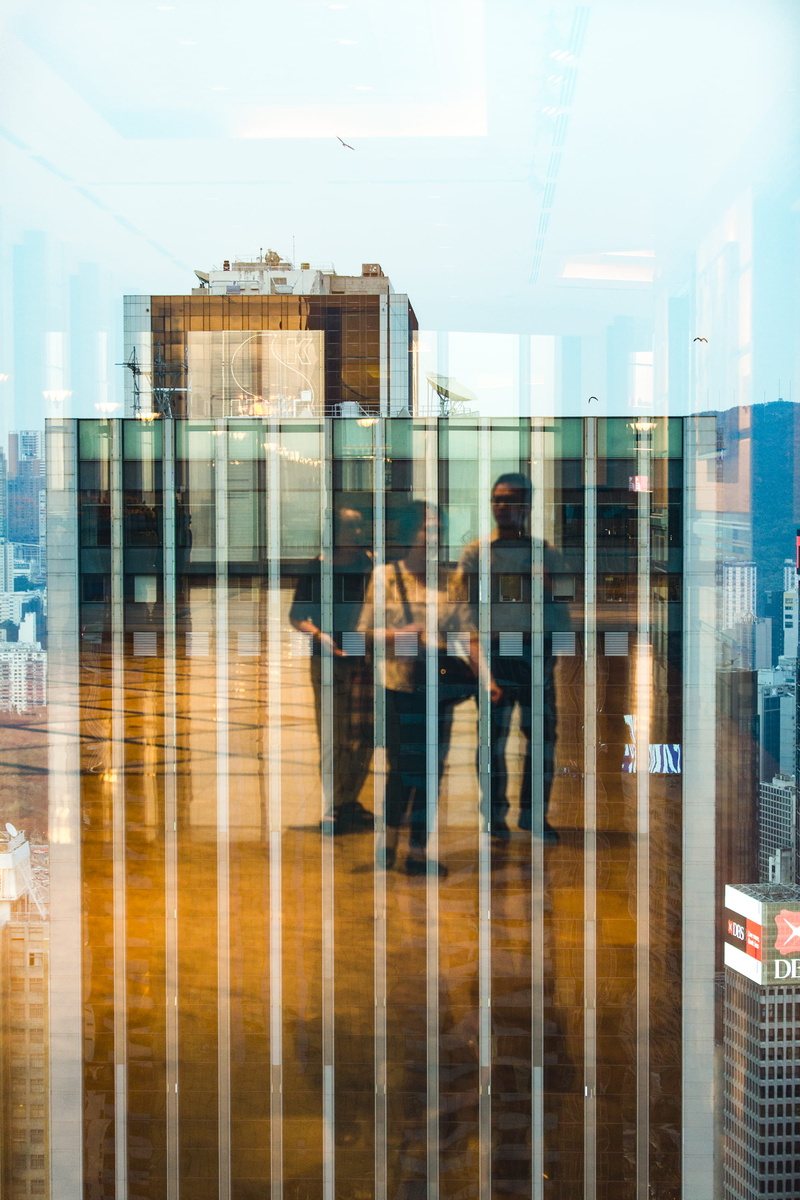 glass - material, window, central, person, reflection, convention center, building, blurred motion, walking, day, city, women, group of people, people