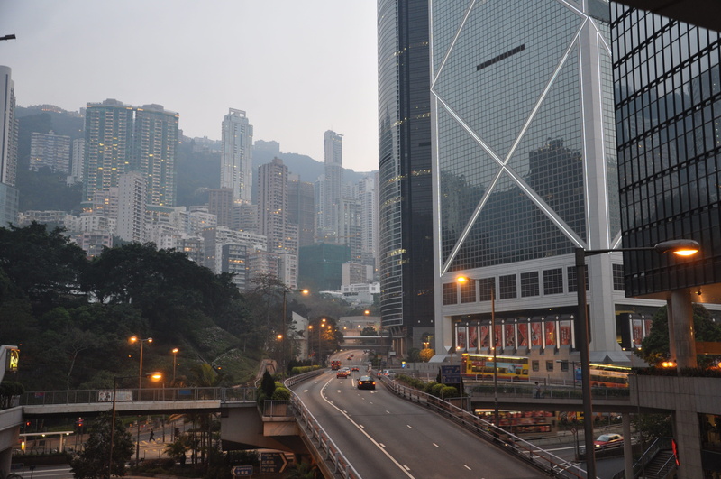 illuminated, city, built structure, financial district, land vehicle, car, twilight, hong kong, mode of transportation, no people, road, sky, transportation