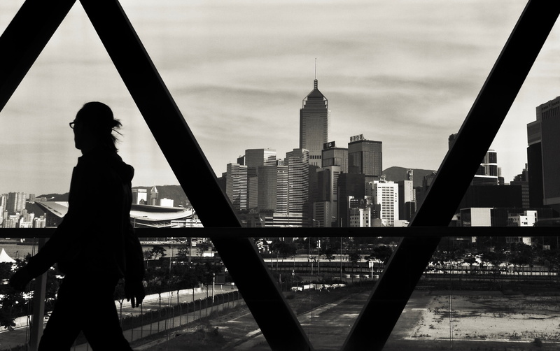 b/w, one person, tall - high, building exterior, spire, tower, travel destinations, real people, city, city life, 2K, outdoors, cloud - sky, lifestyles