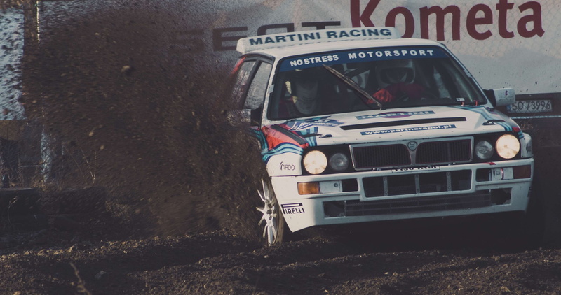 motor sport, retro styled, rally, mode of transportation, gravel, road, nature, real people, communication, transportation, lancia delta, outdoors, city