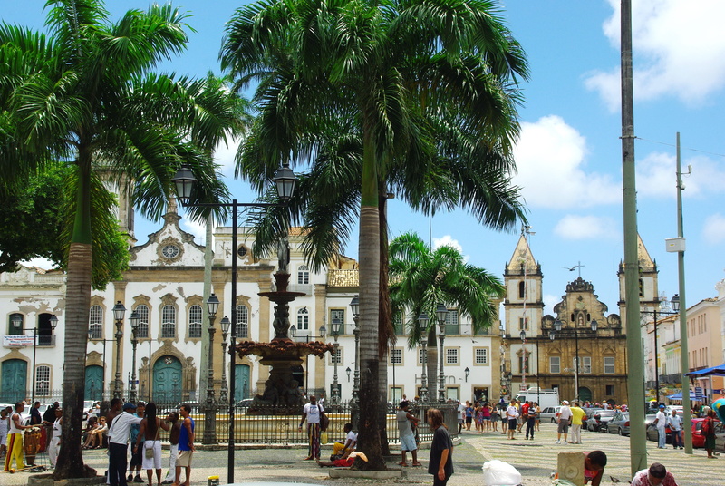 building, tree, architecture, plant, crowd, large group of people, palm tree, religion, church, built structure, city, uptown, travel destinations, convent