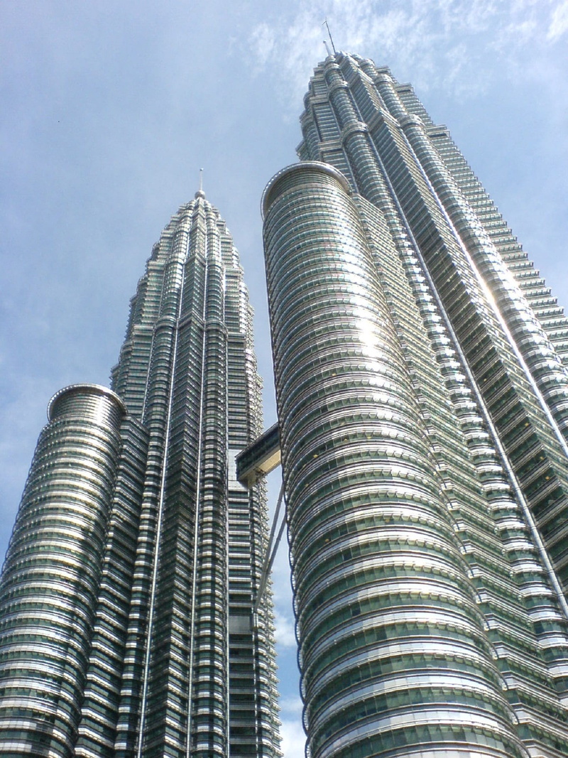 skyscraper, built structure, low angle view, skyscrapers, tall - high, financial district, silver colored, outdoors, office, kuala lumpur, city, malaysia